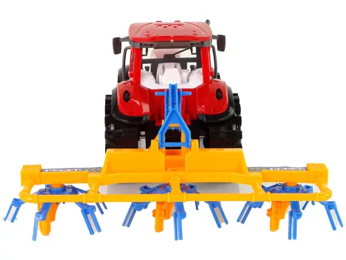 Piros traktor gereblye dörzshajtással
