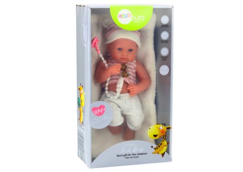 Baba baba fehér és rózsaszín ruhában, sapkában, cumiban és takaróban